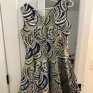 Blue and gold night out dress with a pocket